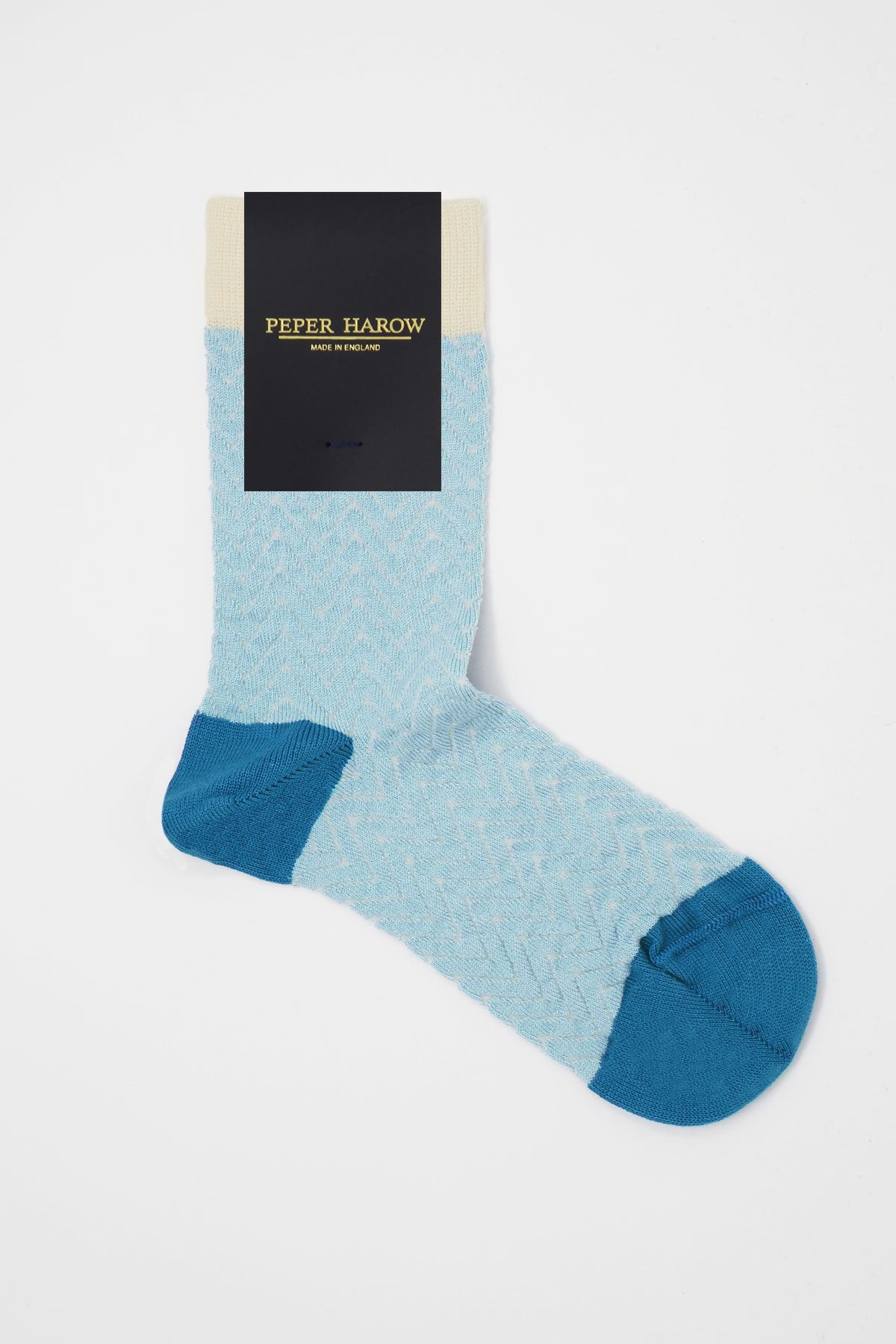 A pair of blue and cream Zigzag women's socks made from luxurious Supima cotton, showcasing a stylish zigzag pattern.