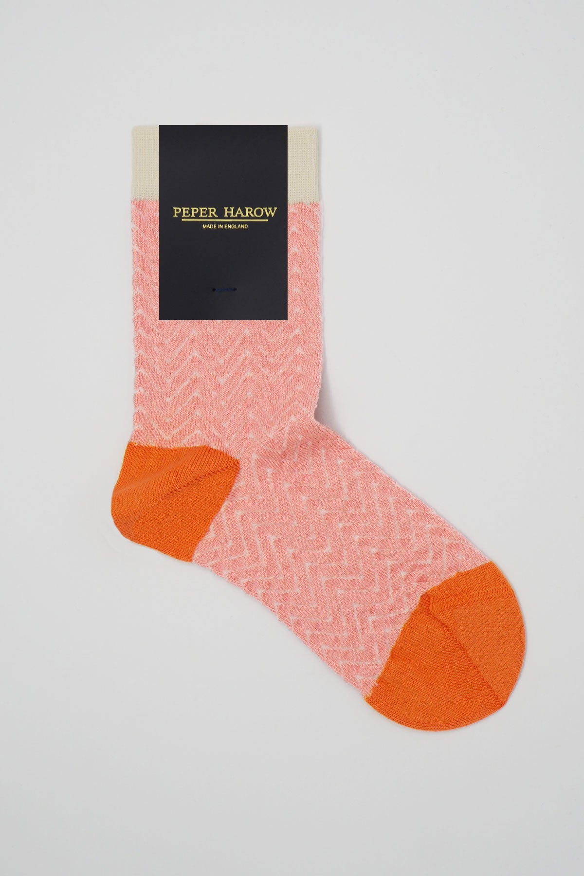 A pair of pink and cream Zigzag women's socks made from luxurious Supima cotton, showcasing a stylish zigzag pattern.