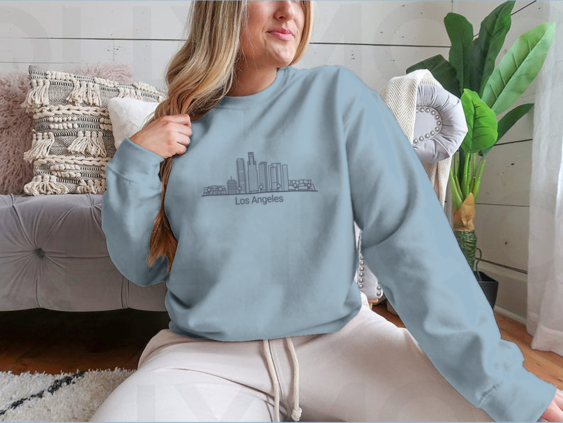 Stylish Banner of Los Angeles City graphic tee in flat line design, showcasing iconic cityscape.