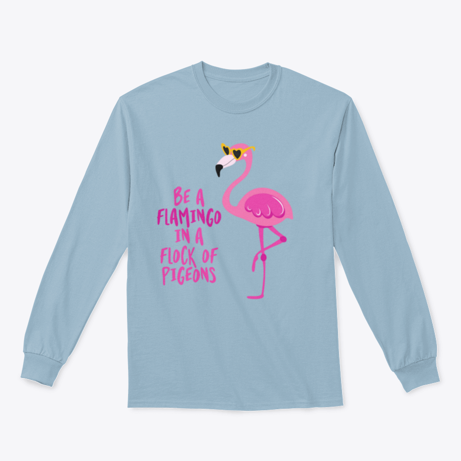 A stylish t-shirt featuring the motivational quote 'Be A Flamingo In A Flock Of Pigeons' in vibrant colors, made from high-quality cotton.