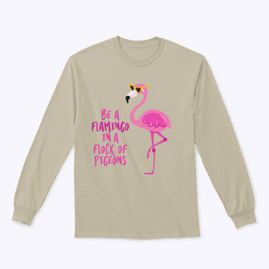 A stylish t-shirt featuring the motivational quote 'Be A Flamingo In A Flock Of Pigeons' in vibrant colors, made from high-quality cotton.