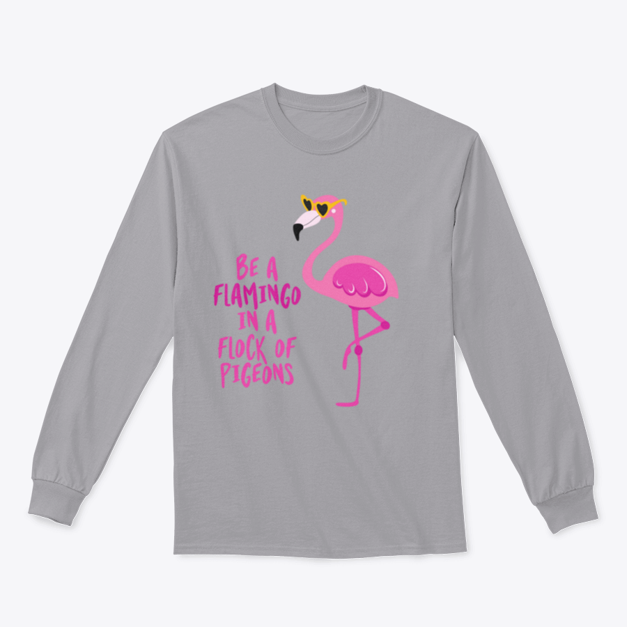 A stylish t-shirt featuring the motivational quote 'Be A Flamingo In A Flock Of Pigeons' in vibrant colors, made from high-quality cotton.