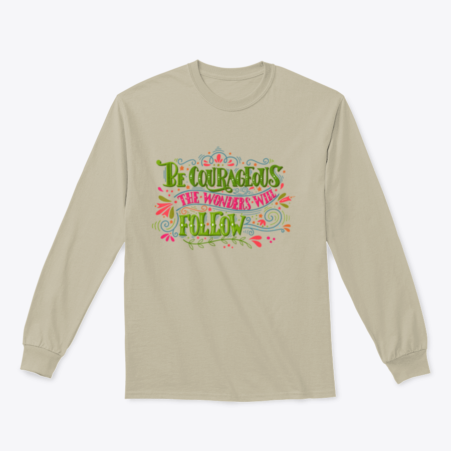 A motivational apparel piece featuring the phrase 'Be Courageous, The Wonders Will Follow' in a stylish design, made from a soft cotton/polyester blend.