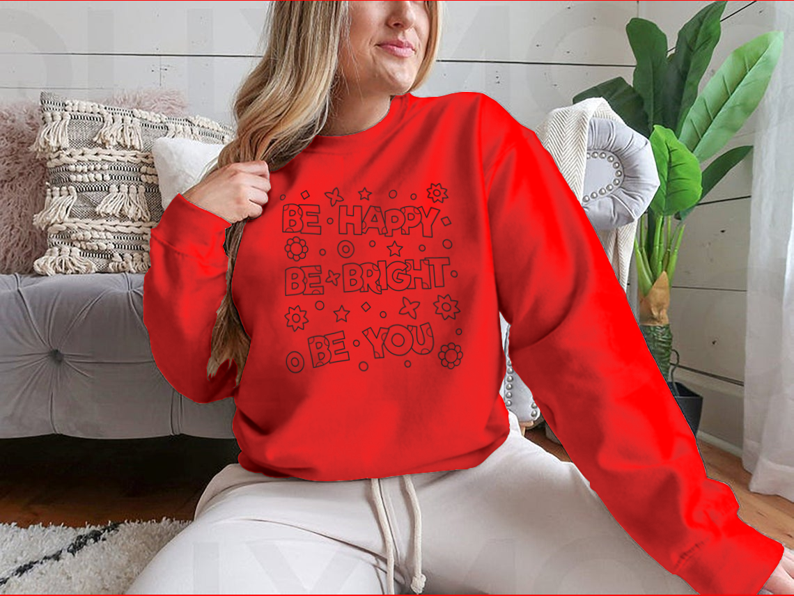 A cozy sweatshirt featuring an inspirational 'Be Happy Be Bright' design, perfect for casual wear.