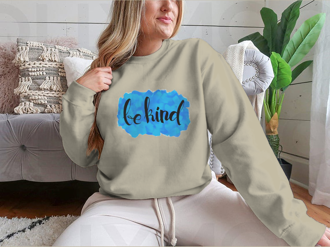 A cozy Be Kind Watercolor Design Sweatshirt featuring a vibrant watercolor print, perfect for casual wear.