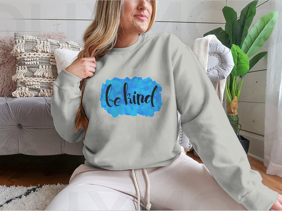 A cozy Be Kind Watercolor Design Sweatshirt featuring a vibrant watercolor print, perfect for casual wear.