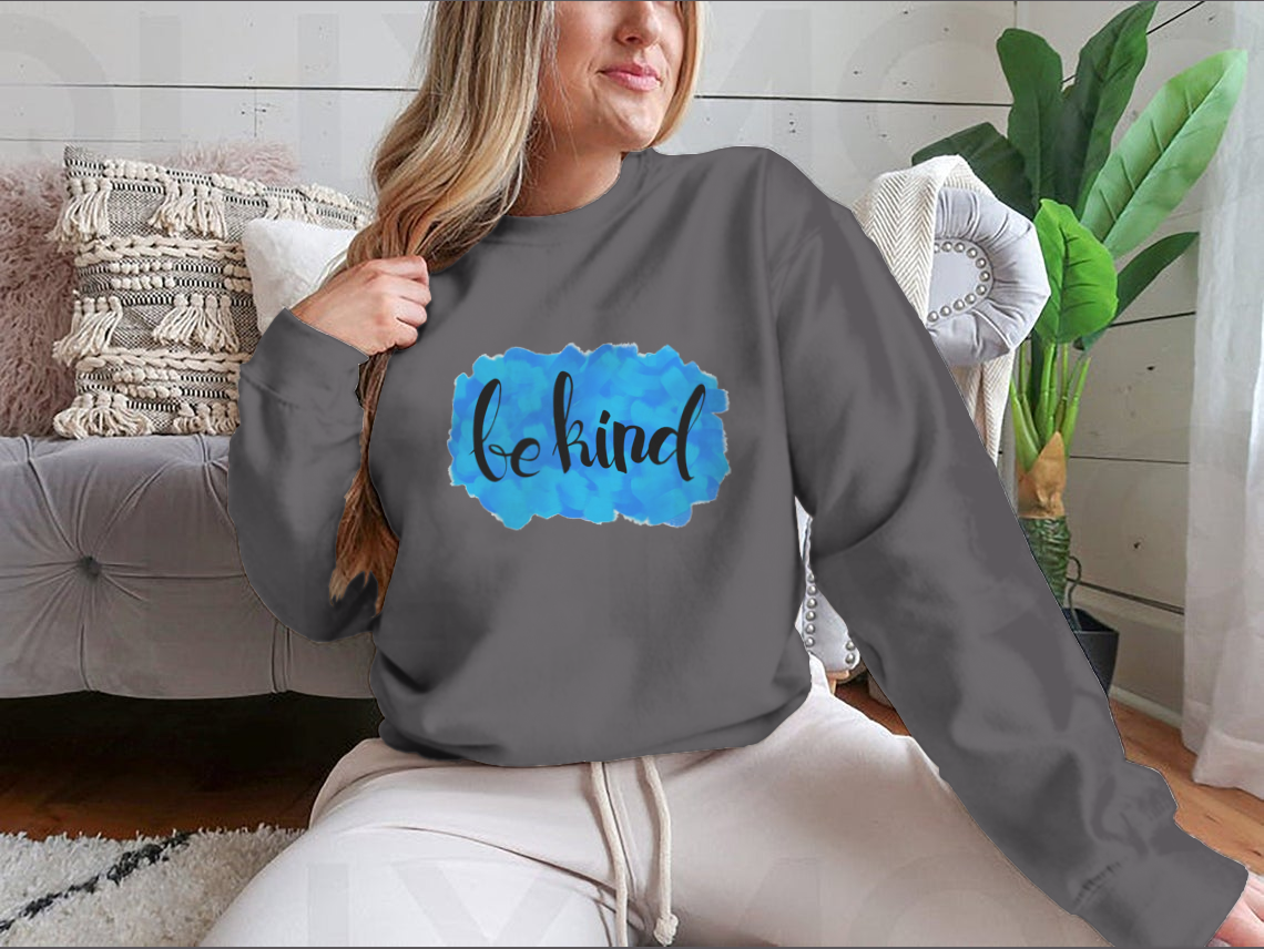 A cozy Be Kind Watercolor Design Sweatshirt featuring a vibrant watercolor print, perfect for casual wear.