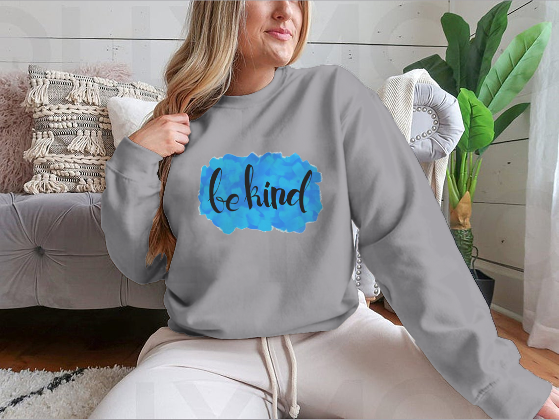 A cozy Be Kind Watercolor Design Sweatshirt featuring a vibrant watercolor print, perfect for casual wear.