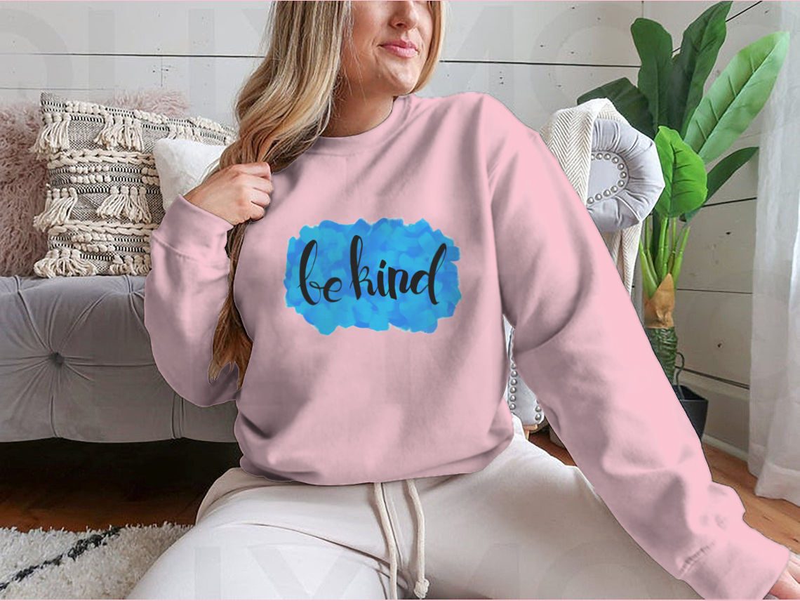 A cozy Be Kind Watercolor Design Sweatshirt featuring a vibrant watercolor print, perfect for casual wear.