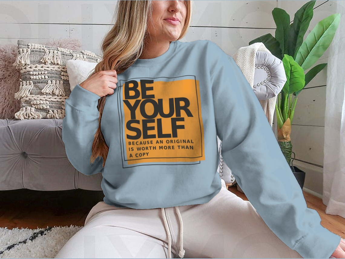 A stylish cotton shirt featuring the phrase 'Be Yourself Because An Original Is Worth More Than A Copy' in a bold design, perfect for casual wear.