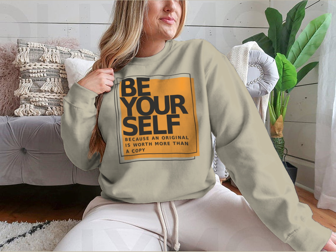 A stylish cotton shirt featuring the phrase 'Be Yourself Because An Original Is Worth More Than A Copy' in a bold design, perfect for casual wear.