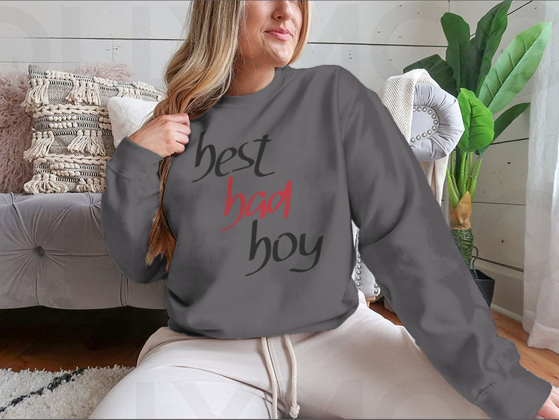 A stylish sweatshirt featuring a unique hand lettering design that reads 'Best Bad Boy', made from a comfortable cotton/polyester blend.