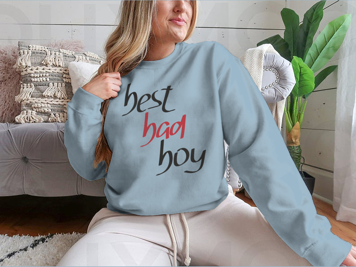 A stylish sweatshirt featuring a unique hand lettering design that reads 'Best Bad Boy', made from a comfortable cotton/polyester blend.