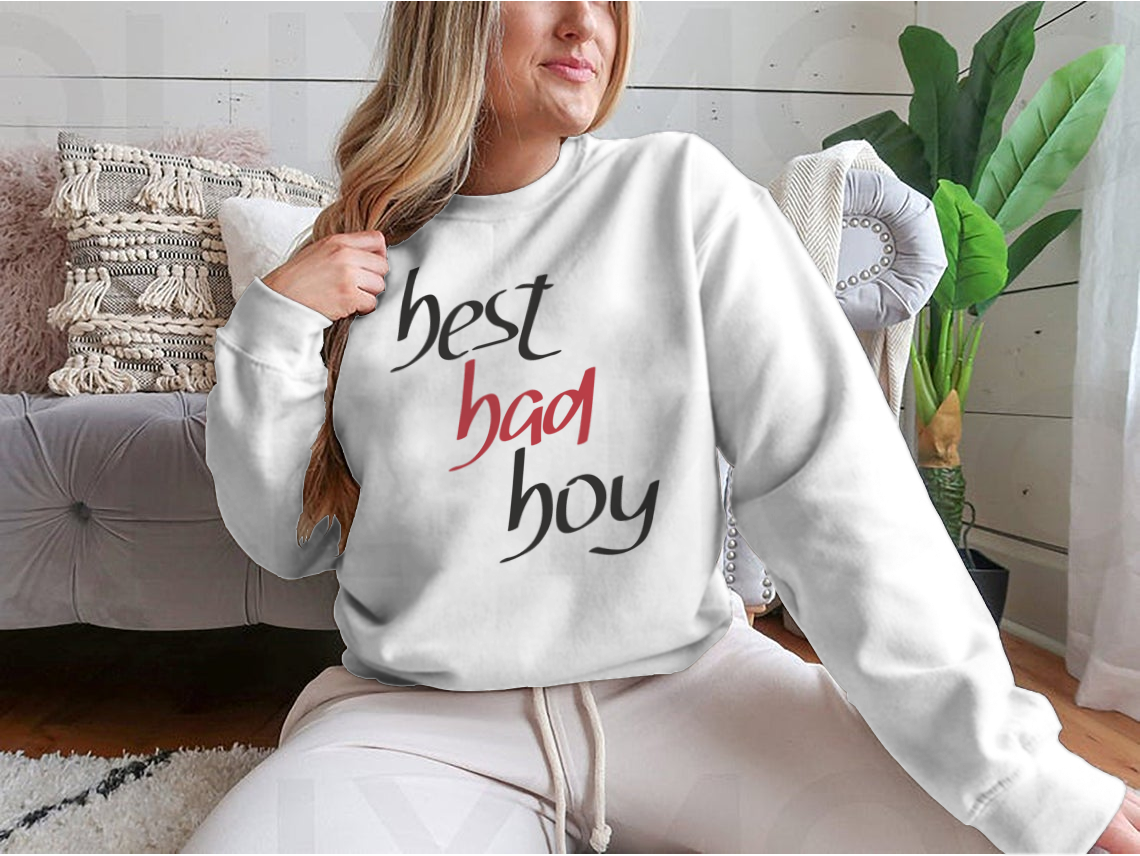 A stylish sweatshirt featuring a unique hand lettering design that reads 'Best Bad Boy', made from a comfortable cotton/polyester blend.