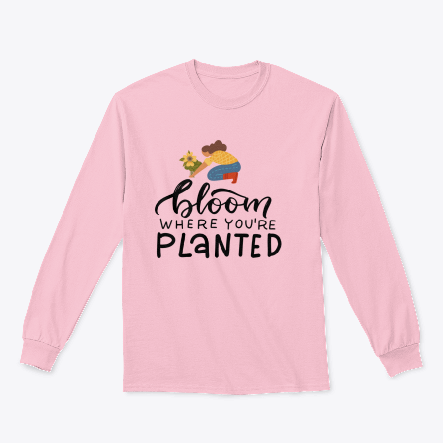 A stylish t-shirt featuring the hand-drawn quote 'Bloom Where You Are Planted' in elegant lettering.