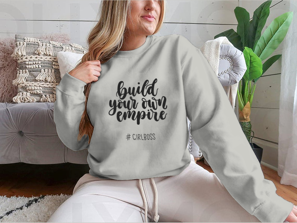 A stylish t-shirt featuring the inspirational quote 'Build Your Own Empire' designed for ambitious women, showcasing a classic fit and soft fabric.