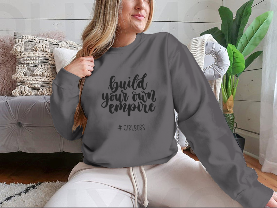 A stylish t-shirt featuring the inspirational quote 'Build Your Own Empire' designed for ambitious women, showcasing a classic fit and soft fabric.