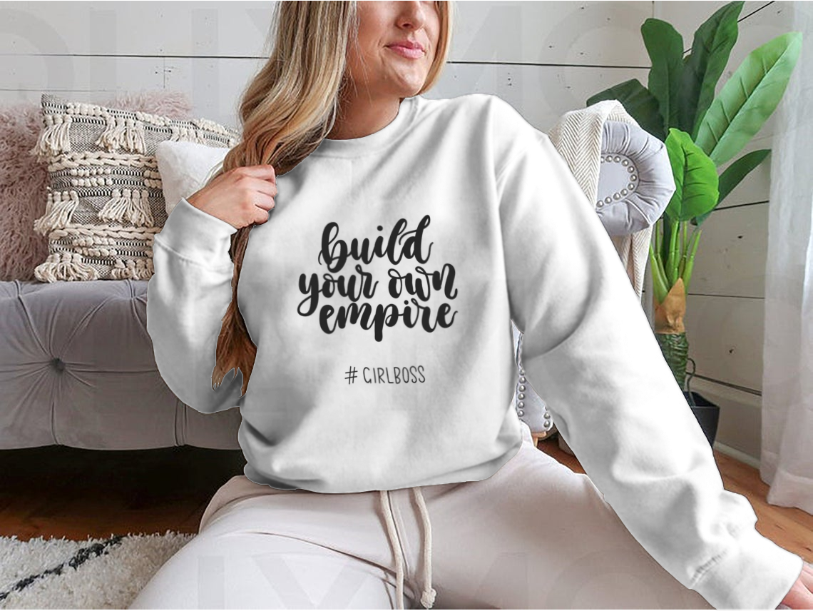 A stylish t-shirt featuring the inspirational quote 'Build Your Own Empire' designed for ambitious women, showcasing a classic fit and soft fabric.