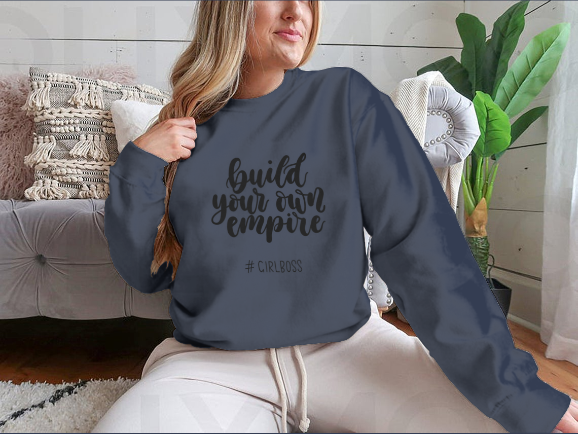 A stylish t-shirt featuring the inspirational quote 'Build Your Own Empire' designed for ambitious women, showcasing a classic fit and soft fabric.