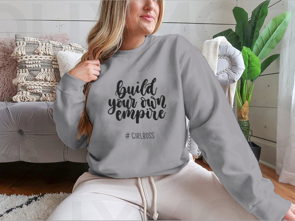 A stylish t-shirt featuring the inspirational quote 'Build Your Own Empire' designed for ambitious women, showcasing a classic fit and soft fabric.