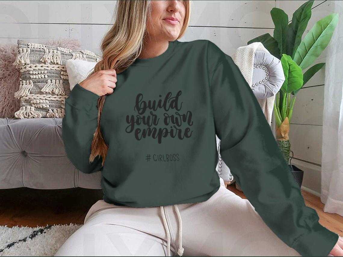 A stylish t-shirt featuring the inspirational quote 'Build Your Own Empire' designed for ambitious women, showcasing a classic fit and soft fabric.