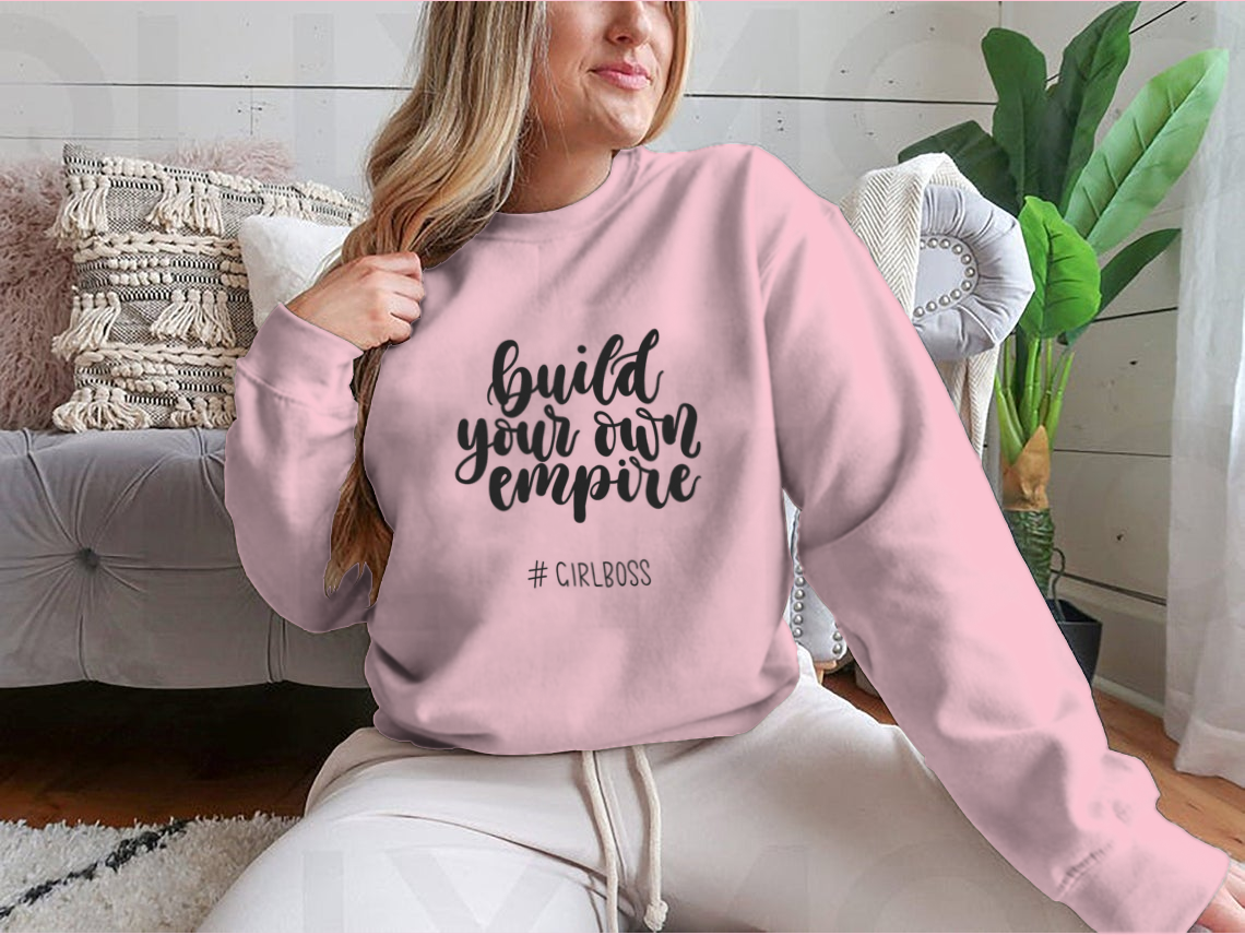 A stylish t-shirt featuring the inspirational quote 'Build Your Own Empire' designed for ambitious women, showcasing a classic fit and soft fabric.