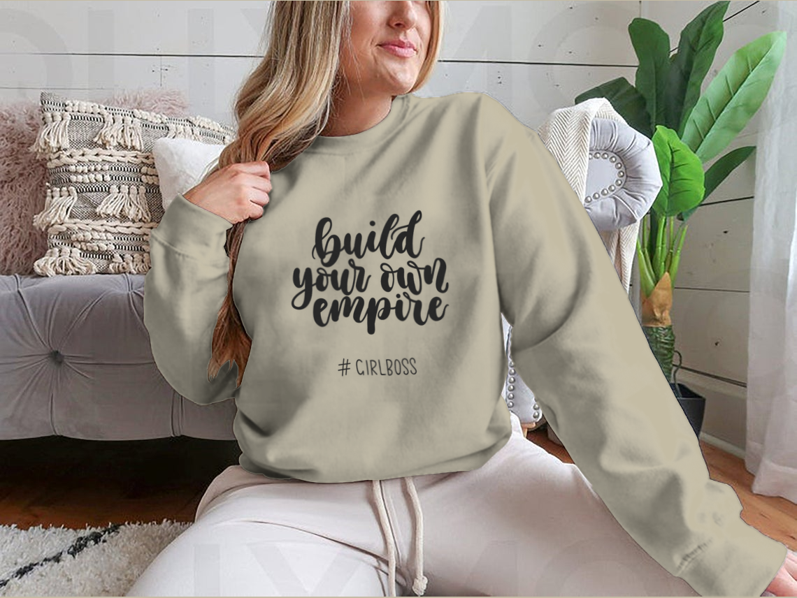 A stylish t-shirt featuring the inspirational quote 'Build Your Own Empire' designed for ambitious women, showcasing a classic fit and soft fabric.