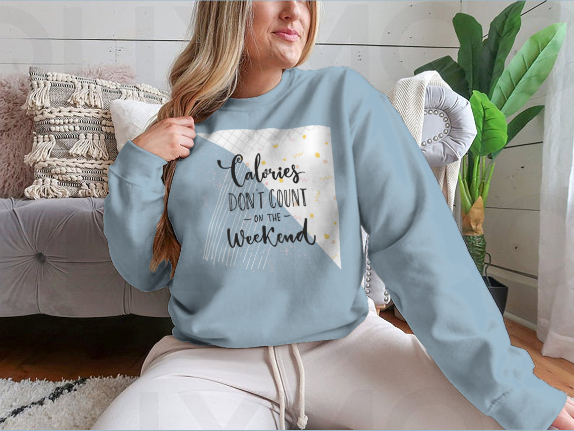 A cozy sweatshirt featuring the phrase 'Calories Don't Count On The Weekend' in a fun design, made from a cotton/polyester blend.