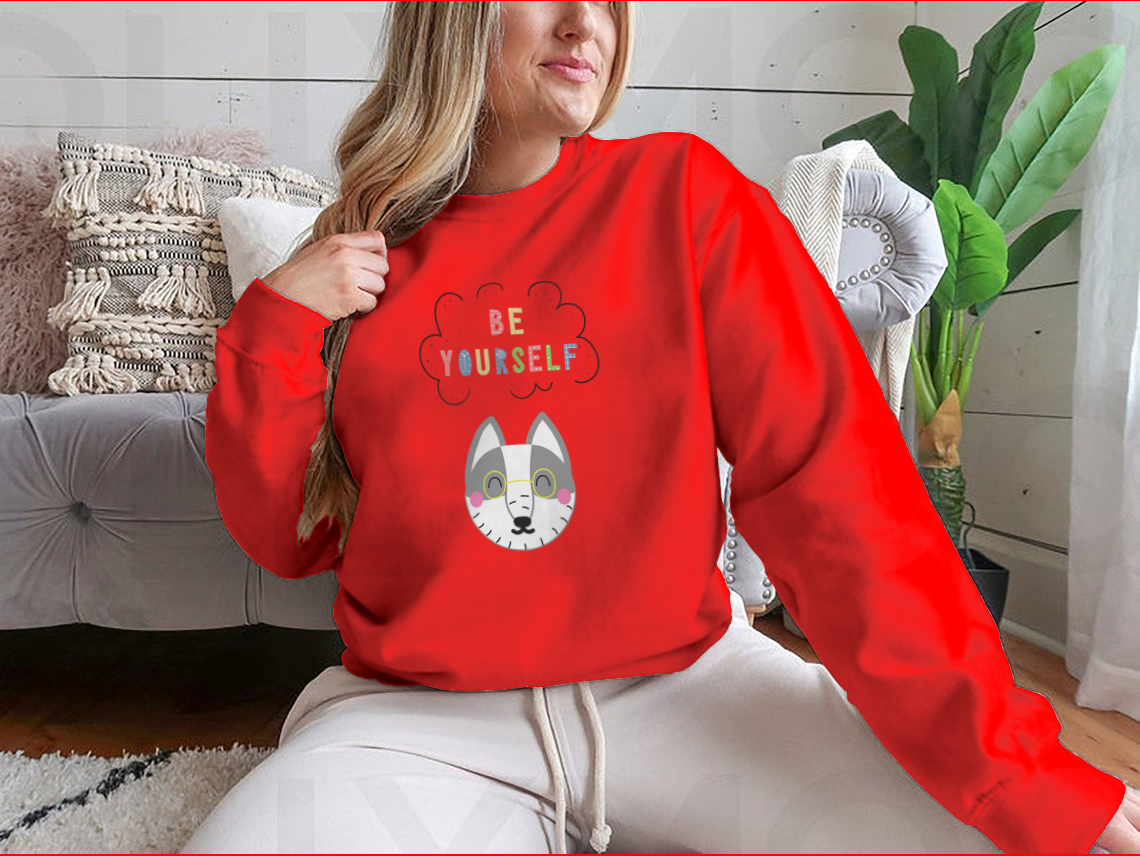 A cozy sweatshirt featuring a playful cartoon animal design with the phrase 'Be Yourself', perfect for casual wear.