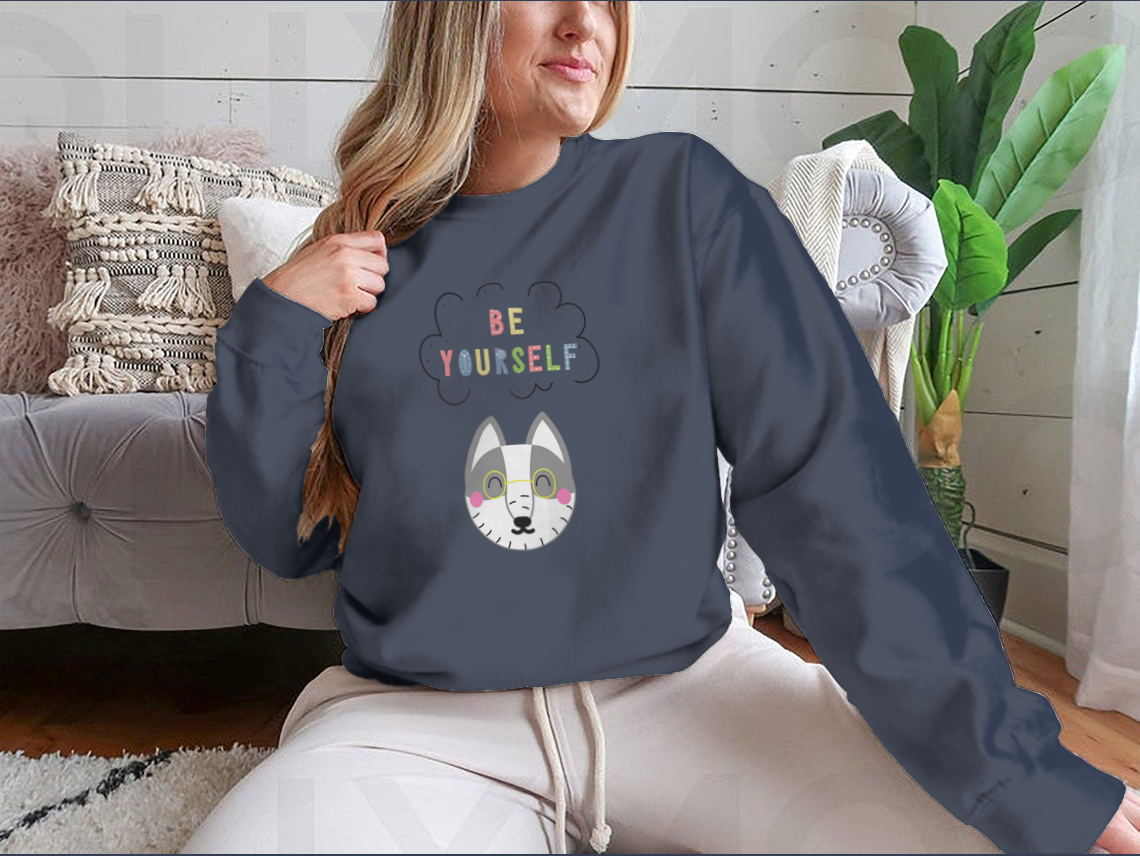 A cozy sweatshirt featuring a playful cartoon animal design with the phrase 'Be Yourself', perfect for casual wear.