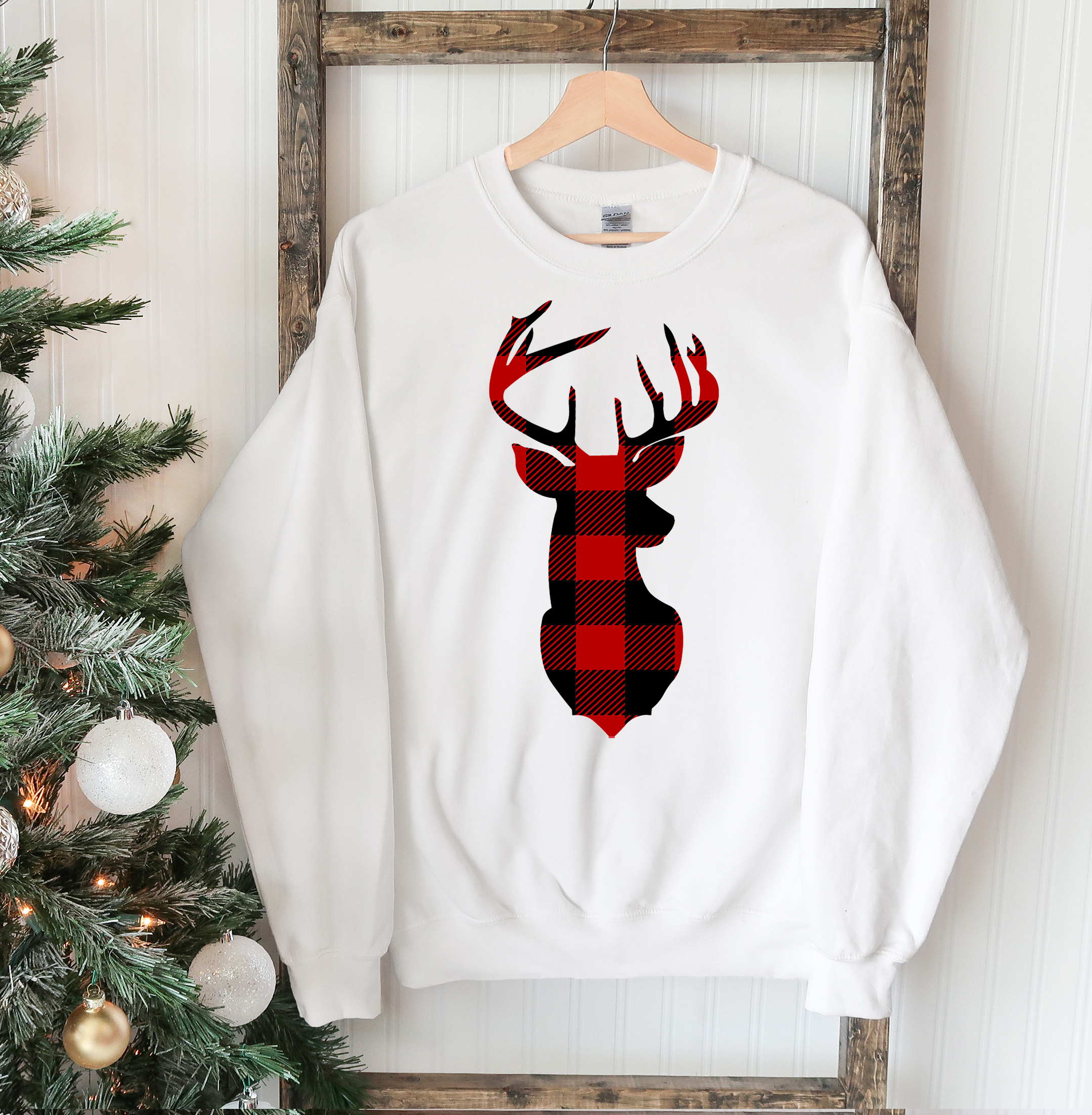 A cozy Christmas Deer Sweatshirt featuring a festive deer design, perfect for holiday celebrations and casual wear.