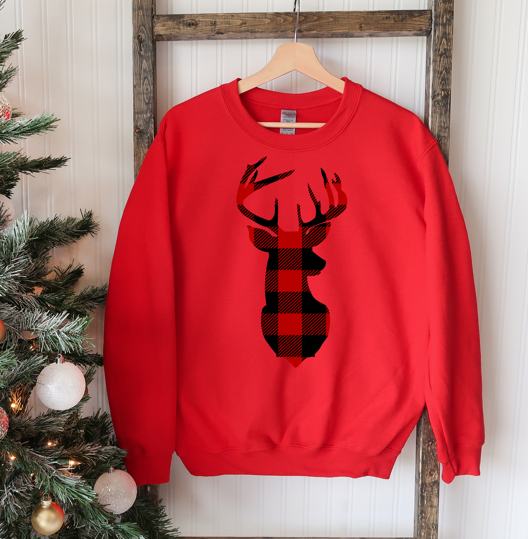 A cozy Christmas Deer Sweatshirt featuring a festive deer design, perfect for holiday celebrations and casual wear.