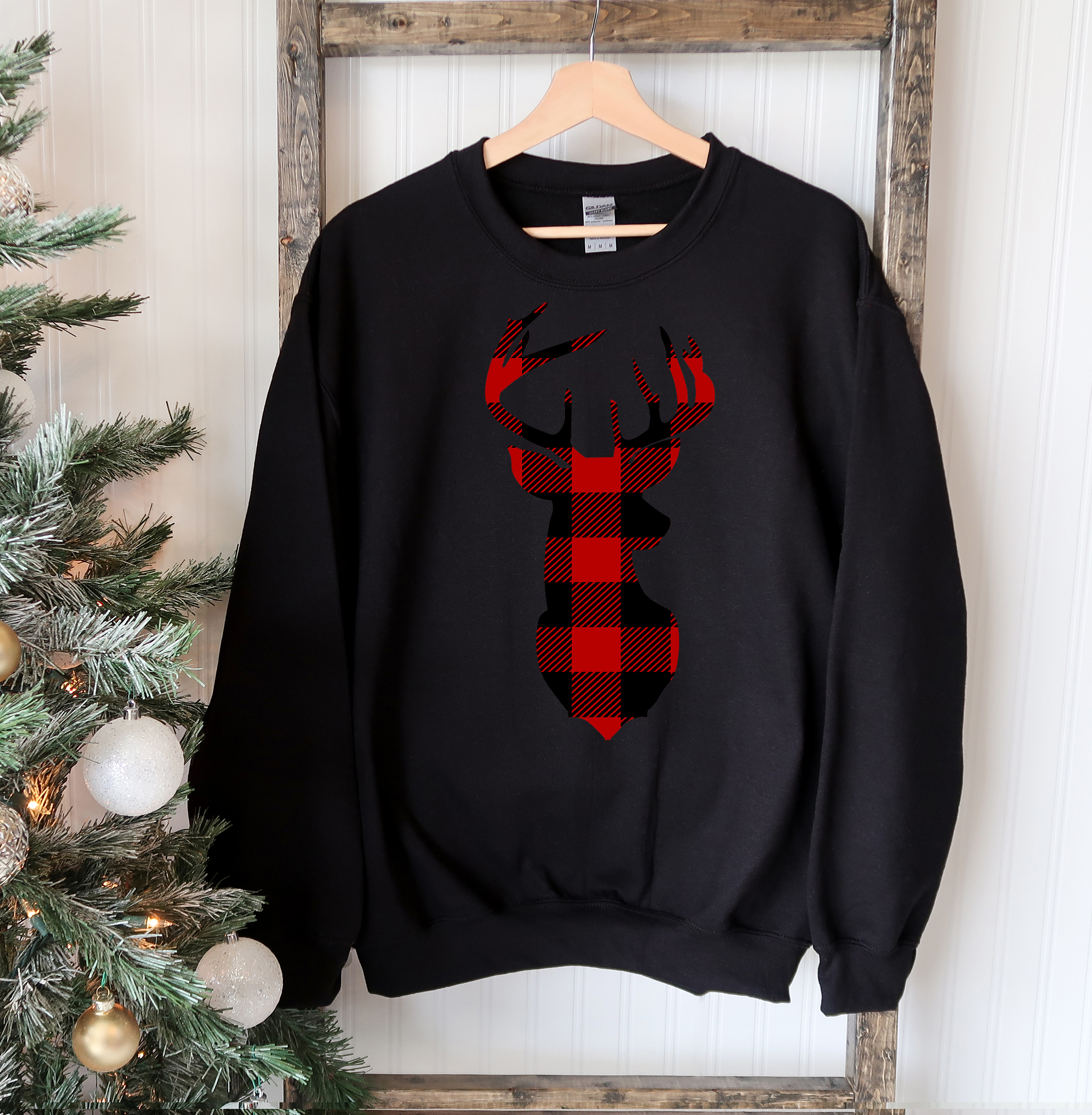 A cozy Christmas Deer Sweatshirt featuring a festive deer design, perfect for holiday celebrations and casual wear.