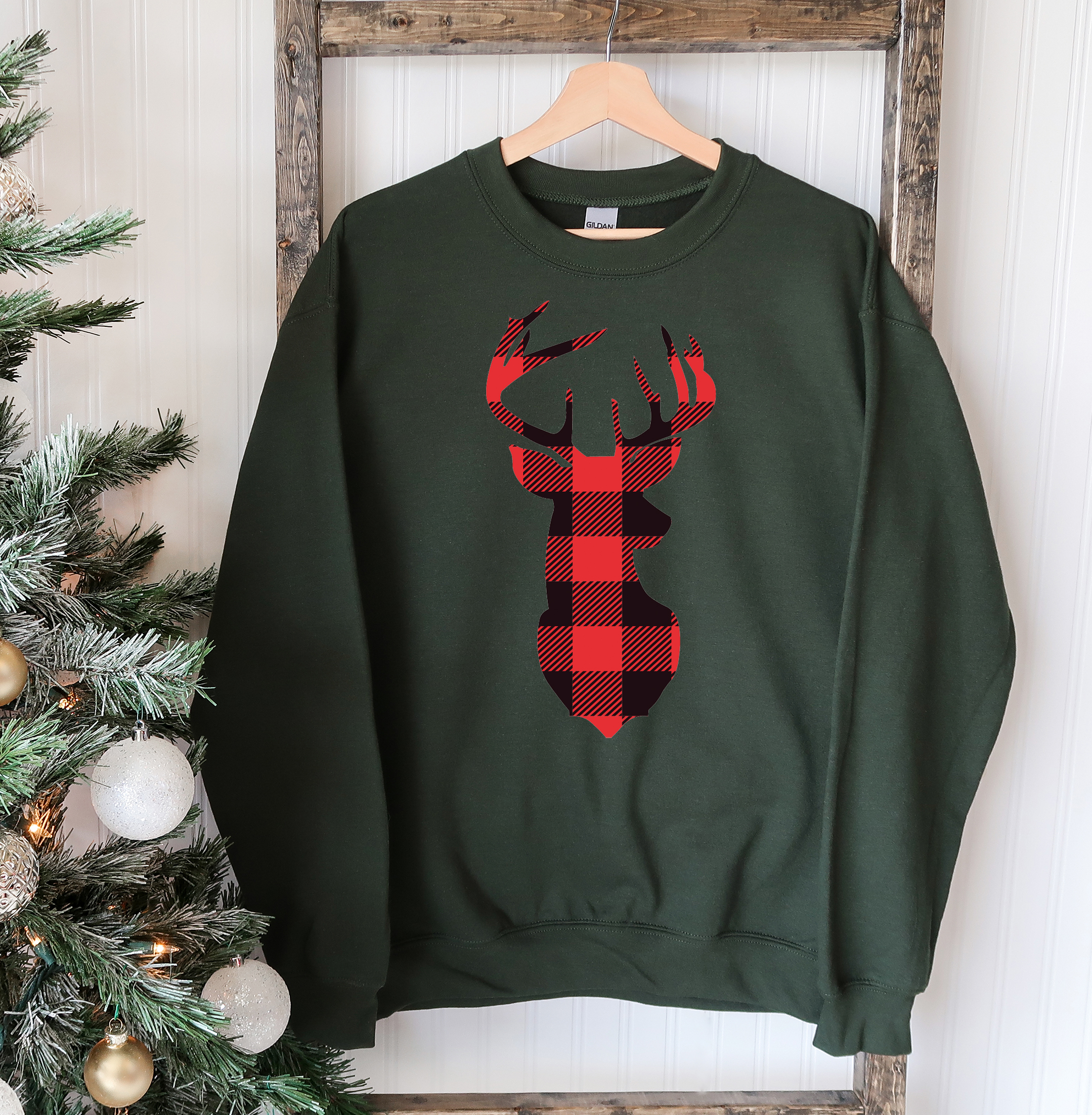 A cozy Christmas Deer Sweatshirt featuring a festive deer design, perfect for holiday celebrations and casual wear.