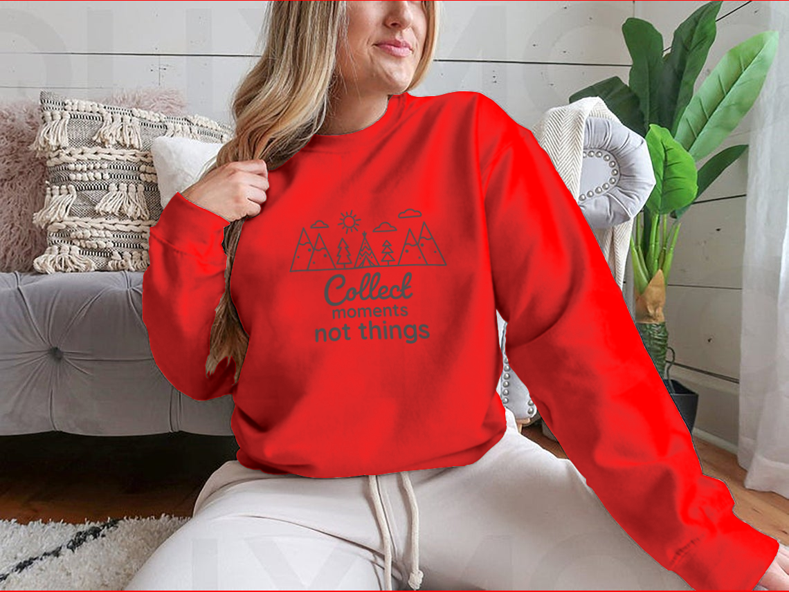 A cozy sweatshirt featuring the inspirational phrase 'Collect Moments Not Things' in a stylish design, perfect for casual wear.