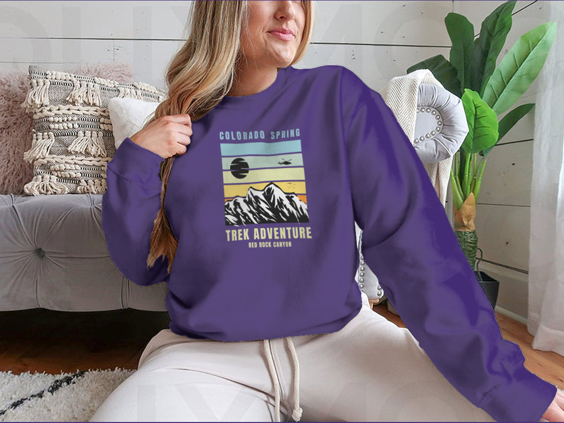 A cozy Colorado Spring Trek Adventure sweatshirt in various colors, showcasing its classic fit and soft fabric.