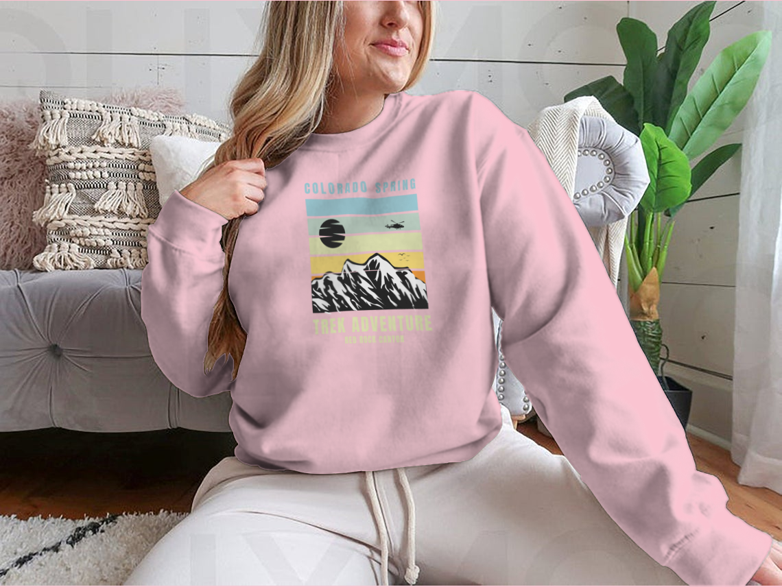 A cozy Colorado Spring Trek Adventure sweatshirt in various colors, showcasing its classic fit and soft fabric.