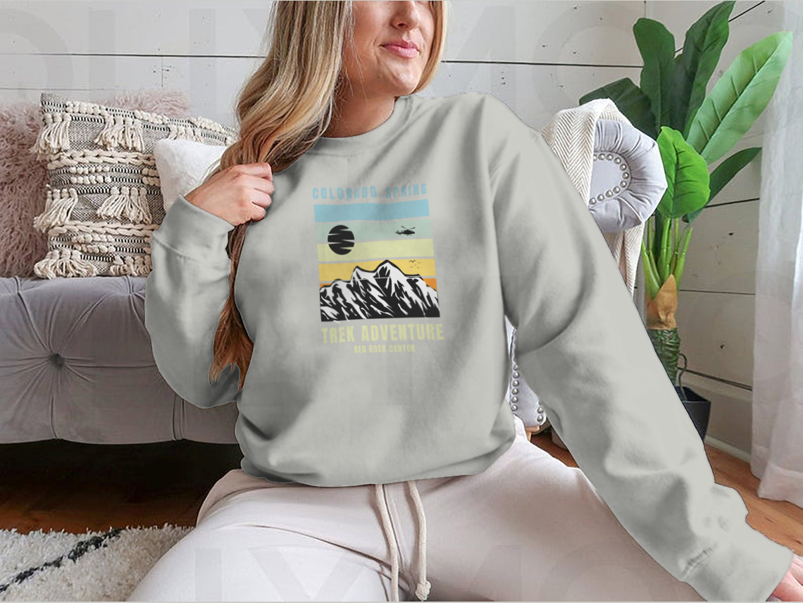 A cozy Colorado Spring Trek Adventure sweatshirt in various colors, showcasing its classic fit and soft fabric.