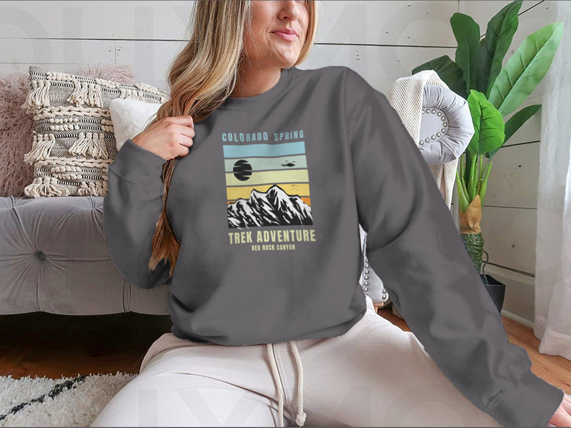 A cozy Colorado Spring Trek Adventure sweatshirt in various colors, showcasing its classic fit and soft fabric.