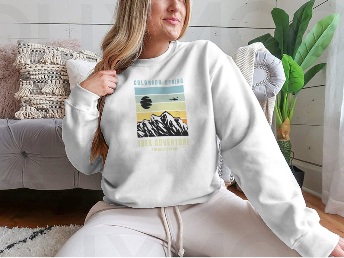 A cozy Colorado Spring Trek Adventure sweatshirt in various colors, showcasing its classic fit and soft fabric.