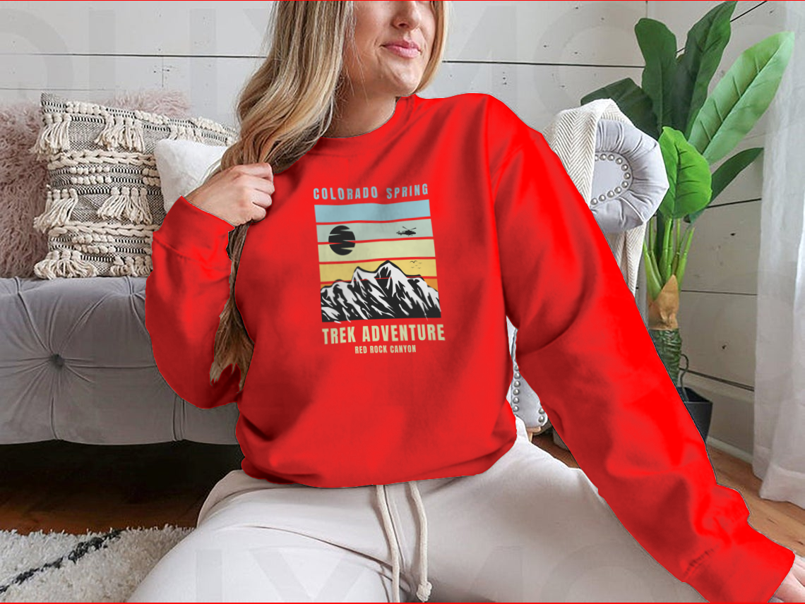 A cozy Colorado Spring Trek Adventure sweatshirt in various colors, showcasing its classic fit and soft fabric.