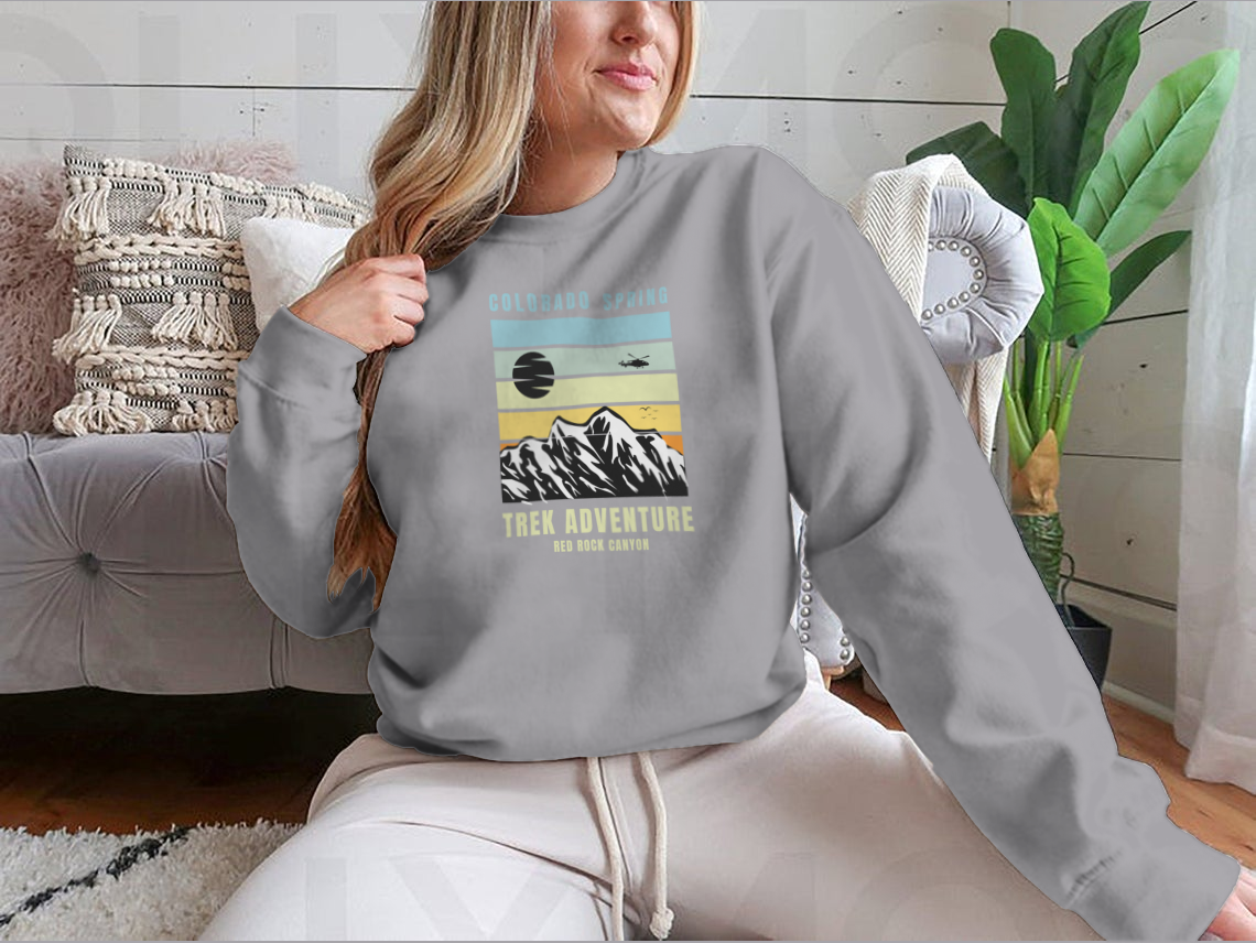 A cozy Colorado Spring Trek Adventure sweatshirt in various colors, showcasing its classic fit and soft fabric.