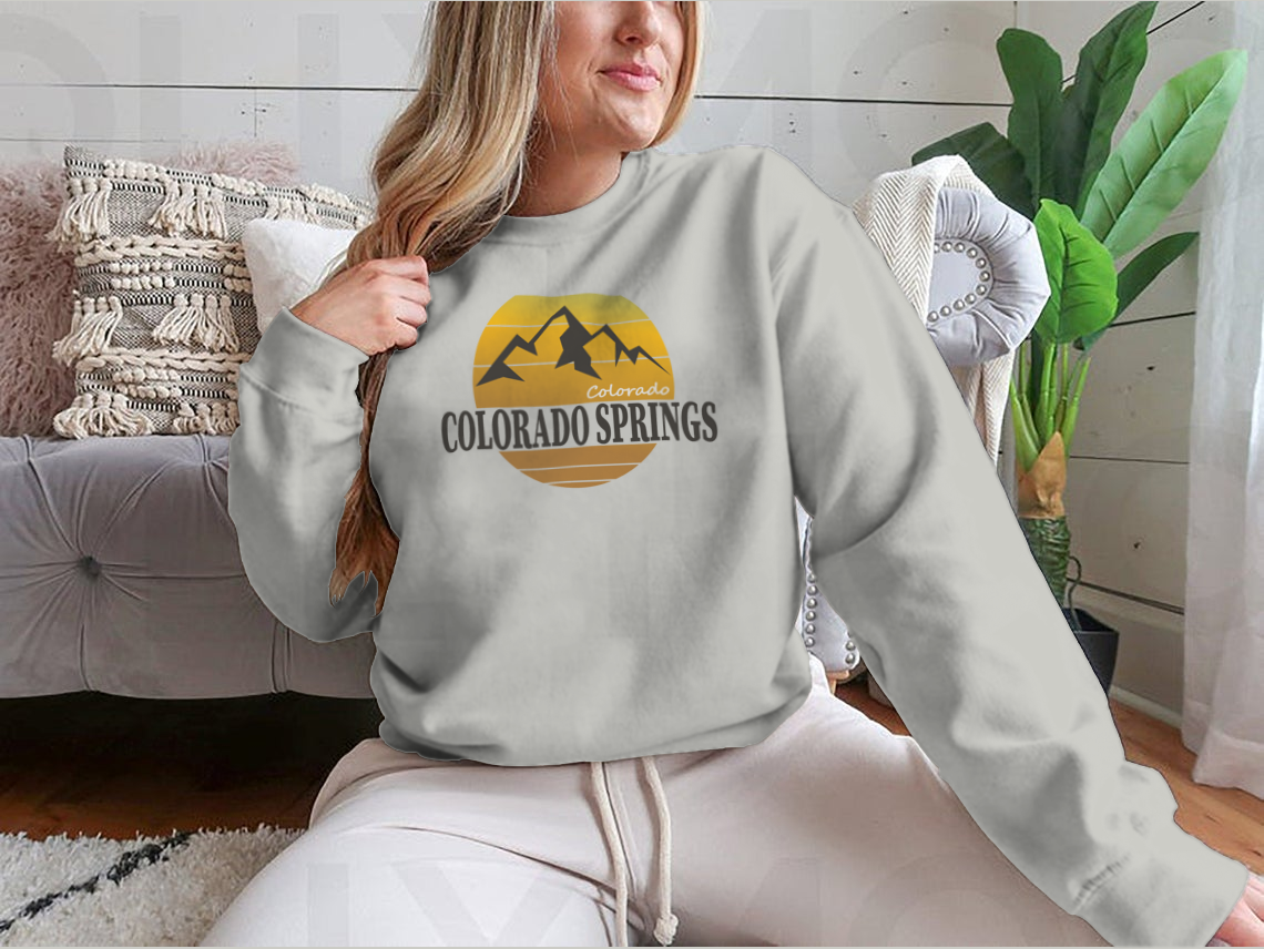 A cozy Colorado Springs Colorado Tourism sweatshirt in various colors, showcasing its classic fit and soft fabric.