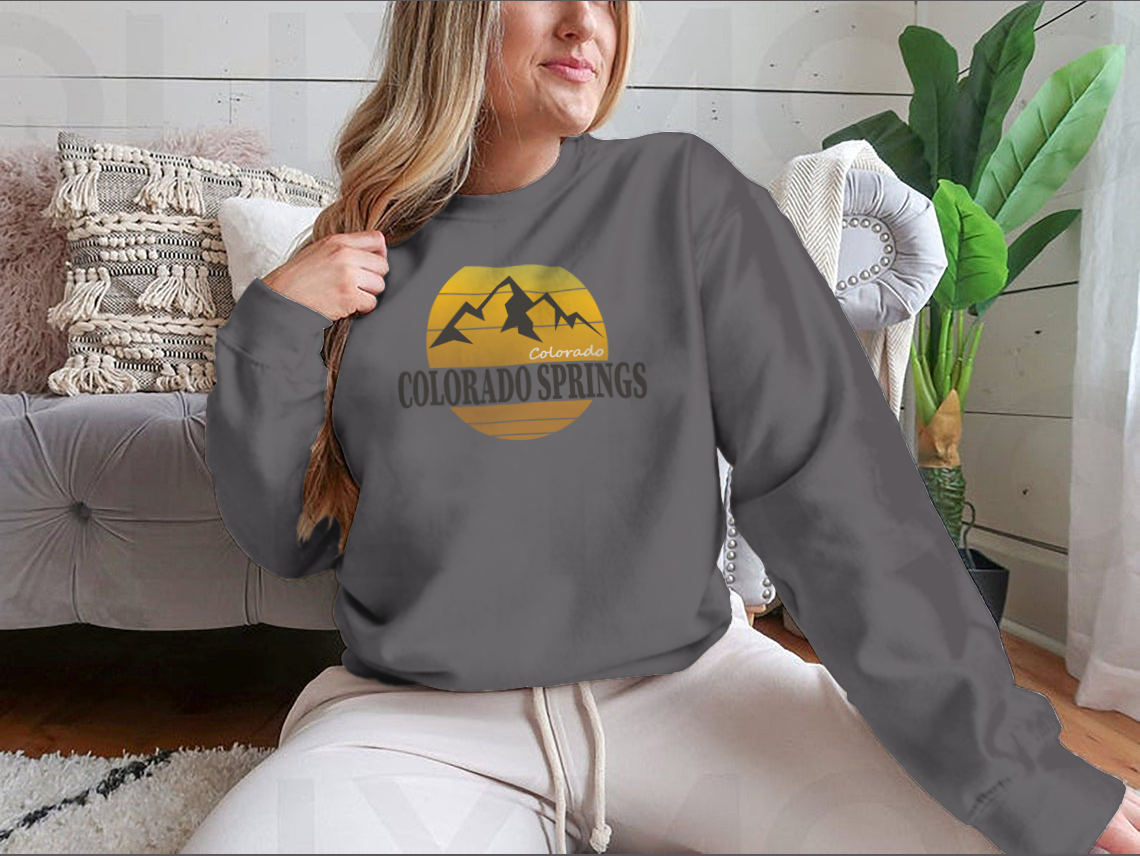 A cozy Colorado Springs Colorado Tourism sweatshirt in various colors, showcasing its classic fit and soft fabric.