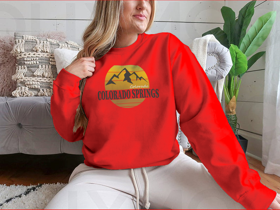 A cozy Colorado Springs Colorado Tourism sweatshirt in various colors, showcasing its classic fit and soft fabric.