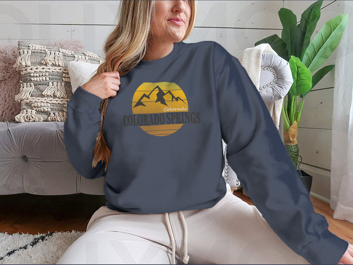 A cozy Colorado Springs Colorado Tourism sweatshirt in various colors, showcasing its classic fit and soft fabric.