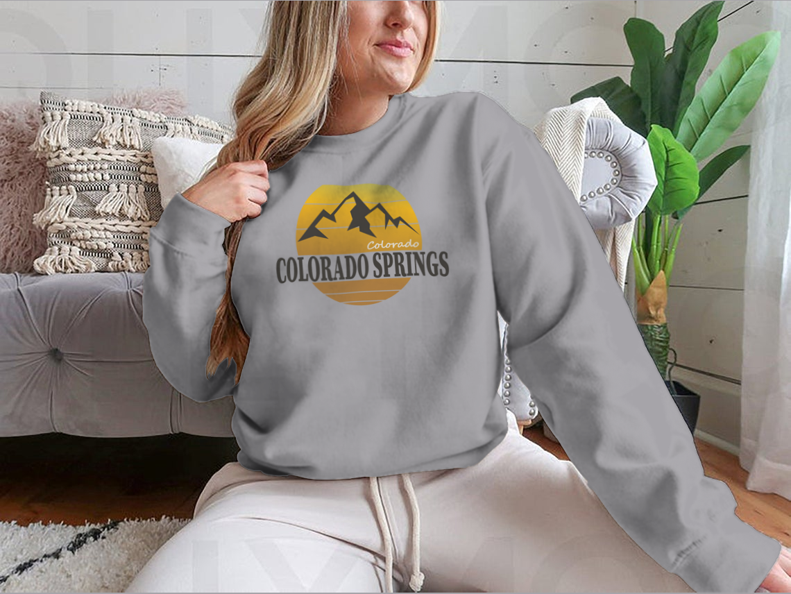 A cozy Colorado Springs Colorado Tourism sweatshirt in various colors, showcasing its classic fit and soft fabric.