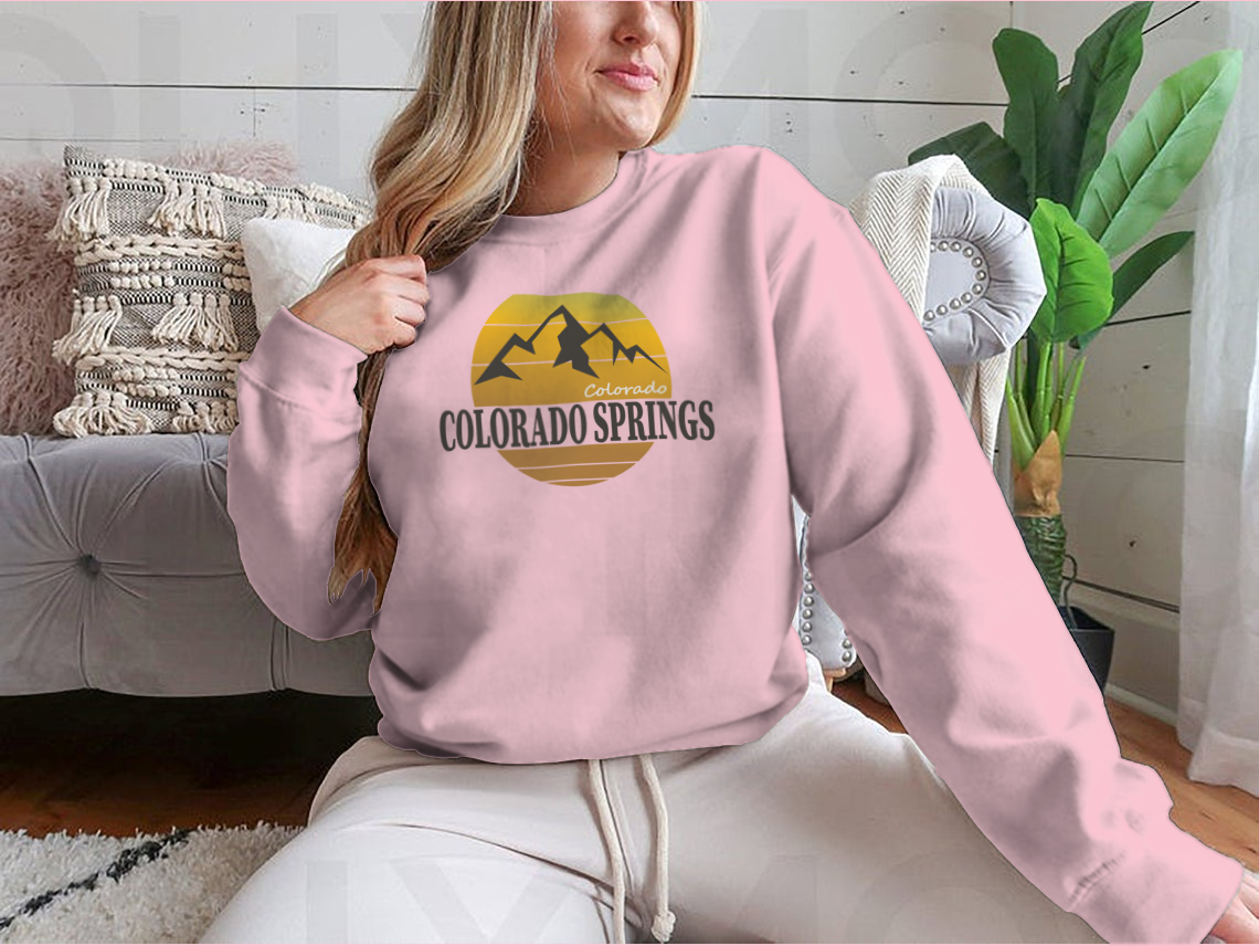 A cozy Colorado Springs Colorado Tourism sweatshirt in various colors, showcasing its classic fit and soft fabric.