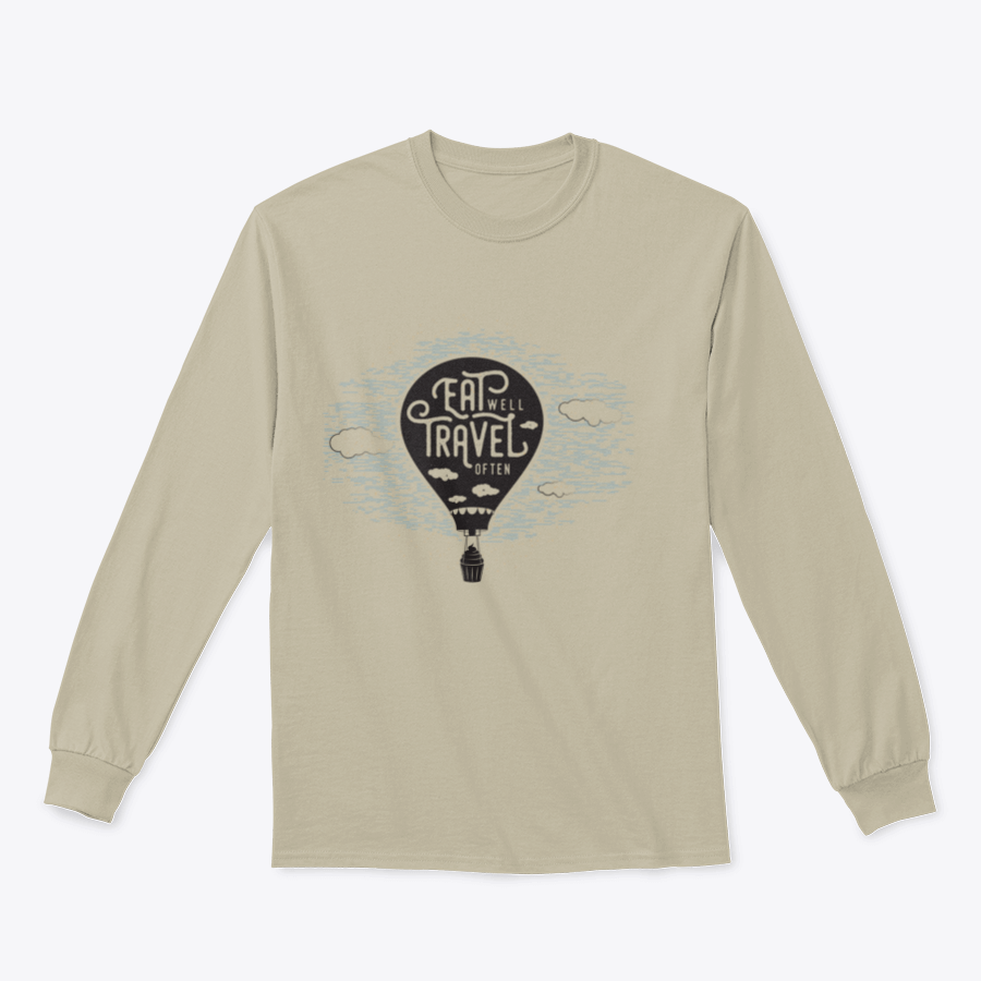 A cozy sweatshirt featuring a cute design of a cupcake riding towards colorful balloons in a bright sky with clouds.