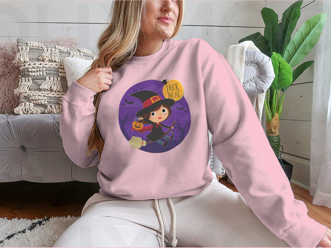 A cute cartoon illustration of a witch flying on a broomstick, featured on a comfortable cotton shirt design.